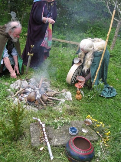 Eimear Burke, attending to the ritual fire.